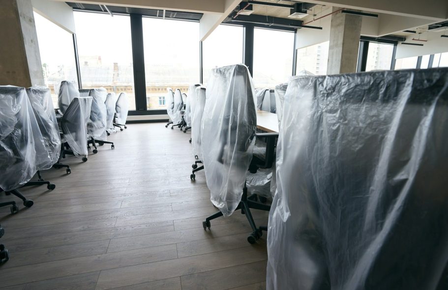 Office Relocation Services – Lewis & Co Moving Group Modern open-plan office interior with desks and equipment ready for relocation.